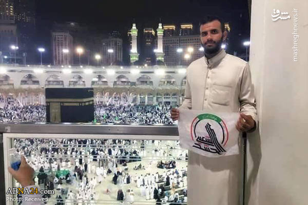 اهتزاز پرچم الحشد الشعبی در جوار خانه خدا 