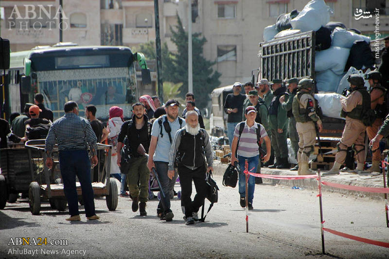  خروج عناصر گروه‌های تروریستی از شهر حمص سوریه 