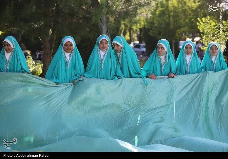 عکس / اهتزاز پرچم منقش به نام حضرت علی (ع) بر فراز همدان 23