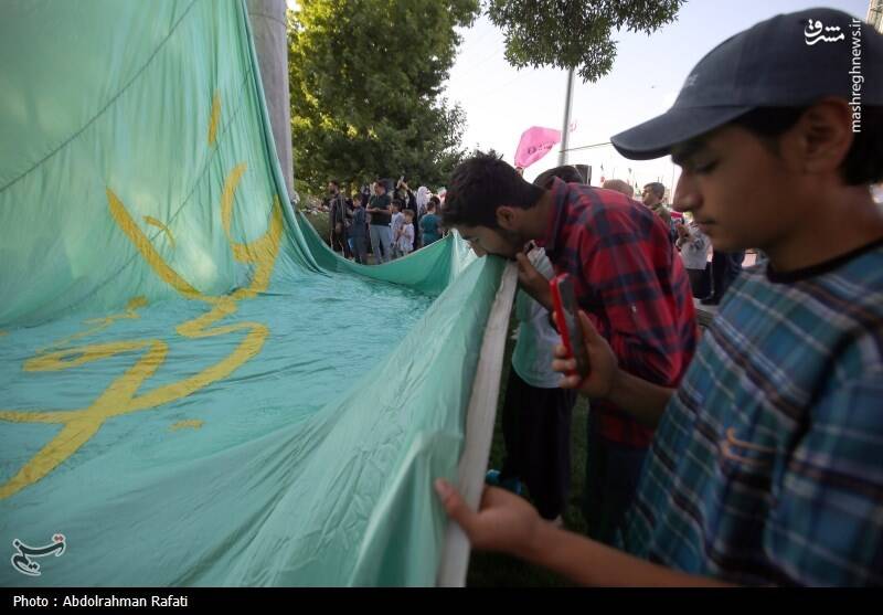 عکس / اهتزاز پرچم منقش به نام حضرت علی (ع) بر فراز همدان 9