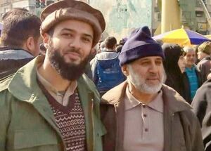 عکس/ حضور شهید رشید و فرزندشان در یکی از راهپیمایی‌های تهران