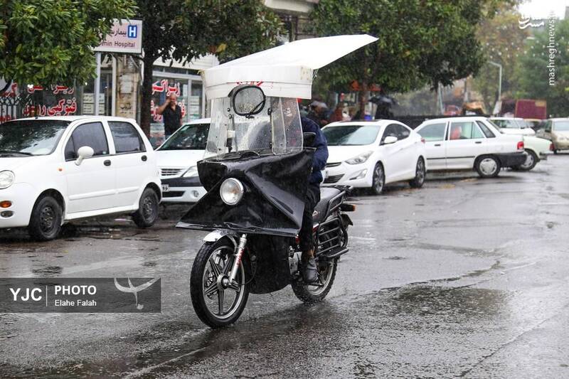 عکس / بدرقه‌ی تابستان با بارش باران در رشت 27