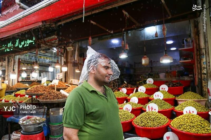 عکس / بدرقه‌ی تابستان با بارش باران در رشت 22