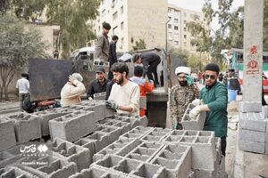 عکس/ جهادگران بسیجی پای کار آسیب‌دیدگان