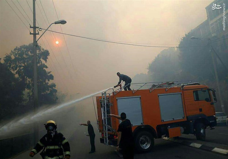 زخمی شدن بیش از ۱۳۰ نفر بر اثر آتش سوزی‌های حیفا و تخلیه ۱۲ منطقه+تصاویر
